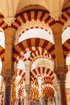 Arches Pillars Mezquita Cordoba Spain.  Created in 785 as a Mosque, was converted to a Cathedral in the 1500.  850 Columns and Arches  