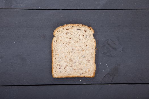 Gluten free bread on black wooden background