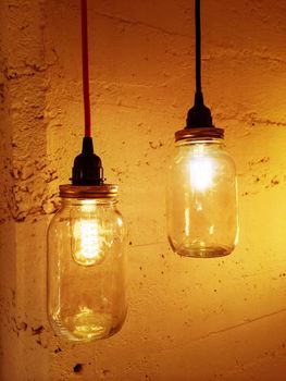 Retro style pendant lights on concrete background. Vintage design.