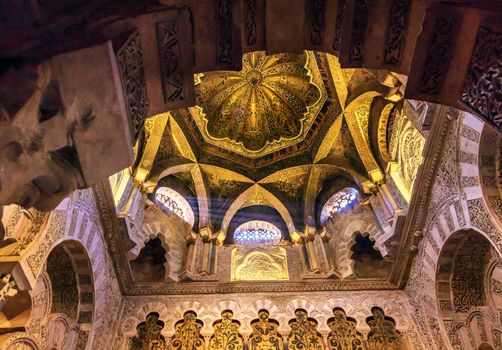 Mihrab Moslem Islam Prayer Niche Golden Dome Arches Mezquita Cordoba Spain.  Mezquita Created in 785 as a Mosque. Mezquita converted to a Cathedral in 1500. 