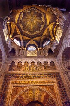 Mihrab Moslem Islam Prayer Niche Golden Dome Arches Mezquita Cordoba Spain.  Mezquita Created in 785 as a Mosque. Mezquita converted to a Cathedral in 1500. 