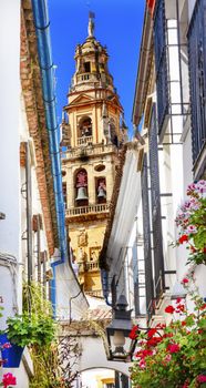 Flower Street Calleja de las Flores Old Torre del Alminar Bell Tower Mezquita Cordoba Andalusia Spain.  Mezquita created in 785 as a Mosque, converted to a Cathedral in the 1500.  Calleja de las Flores old Jewish quarter of Cordoba.