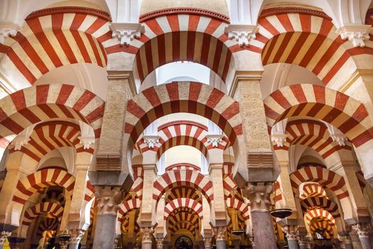 Arches Pillars Mezquita Cordoba Spain.  Created in 785 as a Mosque, was converted to a Cathedral in the 1500.  850 Columns and Arches  