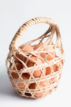 egg in basket wicker on white background,Duck eggs in baskets .