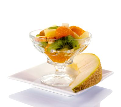 fresh fruit cocktail with apple kiwi in glass