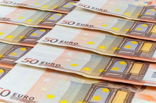 Background of 50 euro banknotes laying in a row