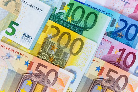 Closeup of euro banknotes forming a money background