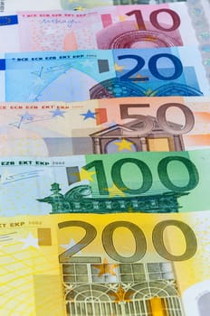 Closeup of euro banknotes forming a money background