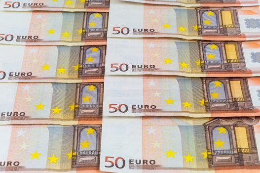 Background of 50 euro banknotes laying in a row