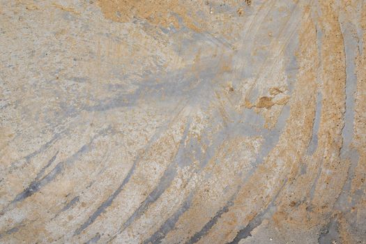 Concrete wall or floor with dirty diagonal stripes strokes pattern on cement