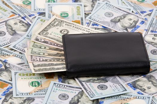 Black wallet with American dollars