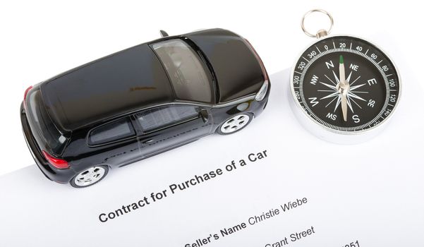 Black car with compass and contract isolated on white background