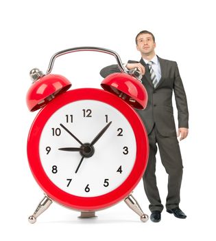 Businessman with big red alarm clock isolated on white background