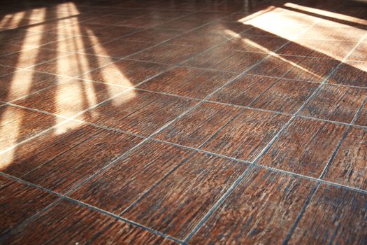 Stony floor with sunlight shadows. Horizontal photo