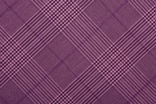 Purple material in geometric patterns, a background or texture