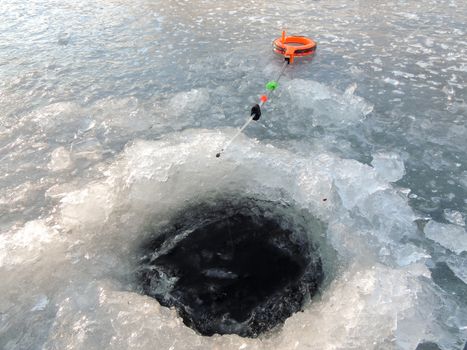 Winter fishing from ice on a fishing tackle in Russia