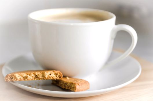 Cup of Coffee with saucer and biscuits