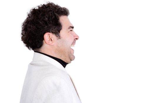 Isolated sideways view of attractive, middle-aged male with curly hair and white jacket laughing