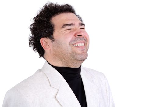 Isolated jovial middle-aged man with stubble and curly hair expressing spontaneous laughter