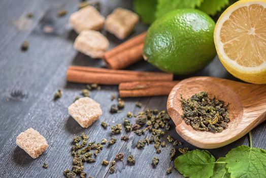 tea composition with cinnamon sticks, lemons
