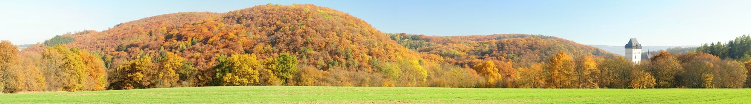 Autumn panorama view of the castle Karlstejn in the sunlight