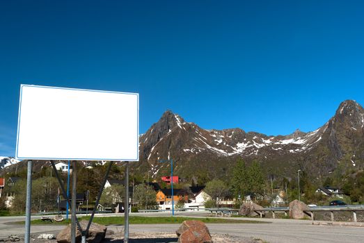 Big white bilboard on the norwegian road in sunny day