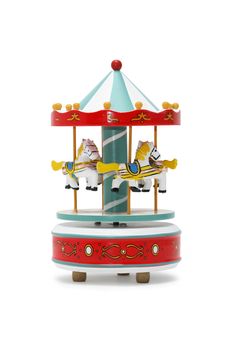 Vintage wooden toy carousel horses on white background. Clipping path is included