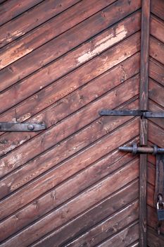 Nice background with old gate made from brown wooden planks