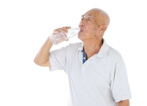 Male senior citizen drinking mineral water