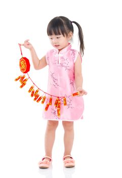 Asian Chinese kid decorating for Chinese new year 