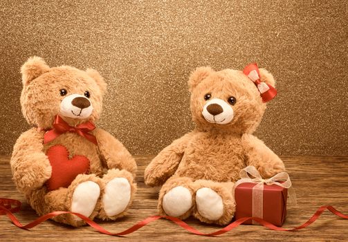 Valentines Day. Love heart. Couple Teddy Bears loving, date. Handmade red heart ribbon  gift box. Vintage retro romantic . Unusual creative greeting card on wood, shiny. Family, wedding, friendship
