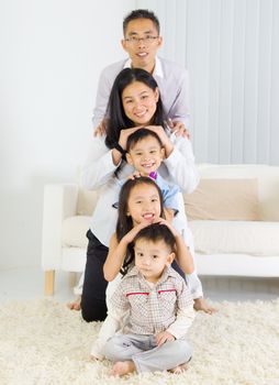 Indoor portrait of asian family