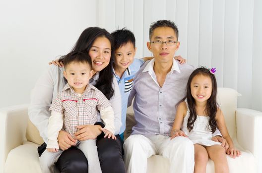 Indoor portrait of asian family