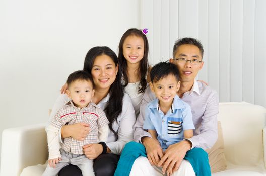 Indoor portrait of asian family