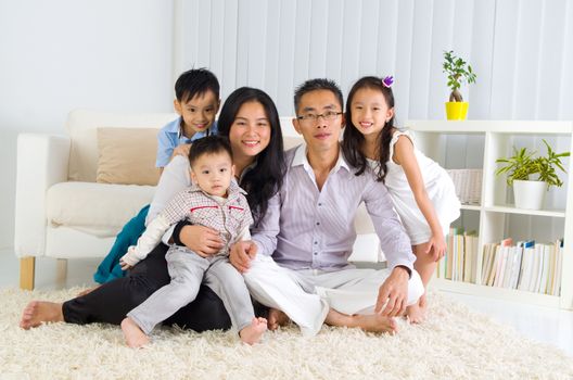 Indoor portrait of asian family