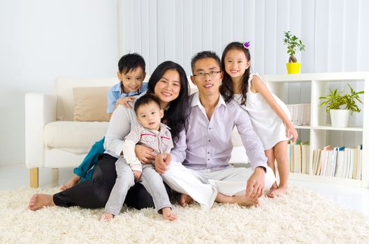 Indoor portrait of asian family