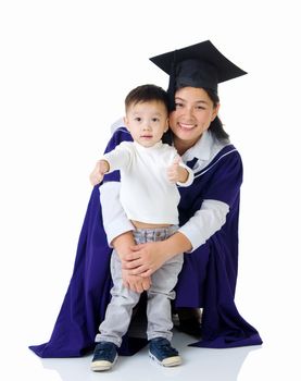Asian mother in graduation gown.Taking photo with her son.