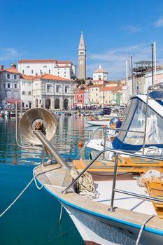 Picturesque old town Piran - beautiful Slovenian adriatic coast. Tartini Square viewed from old fisherman's port. Vertical composition.