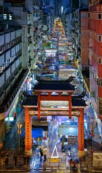 HONG KONG, CHINA - DEC 27, 2015: Crowded people walk through the market on December 27, 2015 in Mong Kok, Hong Kong. Mong Kok, Hong Kong is the highest population density place in the world.