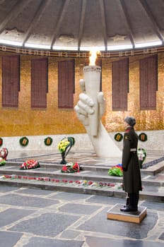 Volgograd, Russia - November 5, 2015: View of the Hall of Military Glory, honor guard and the eternal flame in the historical-memorial complex "To Heroes of the Battle of Stalingrad," Mamayev Kurgan, Volgograd