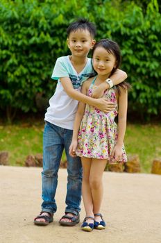 Outdoor portrait of little asian kids