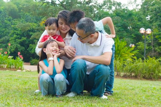 asian family having fun time at outdoor