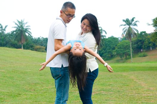 asian family having fun time at outdoor