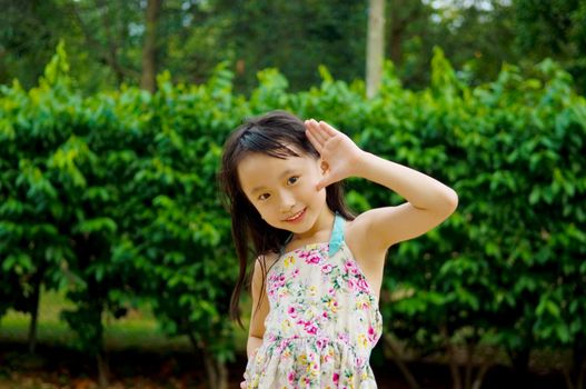Outdoor portrait of little asian girl