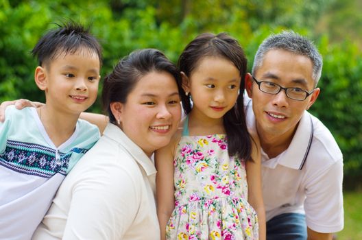 Outdoor portrait of asian family