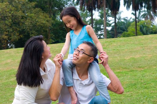 Asian family having fun in the park