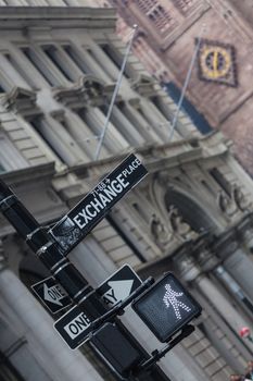 New York stock exchange street sign and go trafic light on a semaphore in New York City, USA. Invest. Bull market ahead.