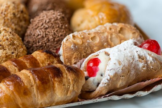 In the pictured colorful pastries with candied,cream and chocolate, the real Italian confectionery.