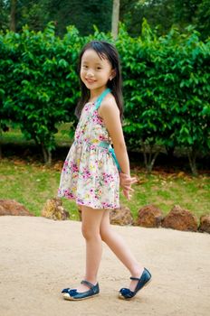 Outdoor portrait of little asian girl