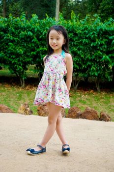 Outdoor portrait of little asian girl